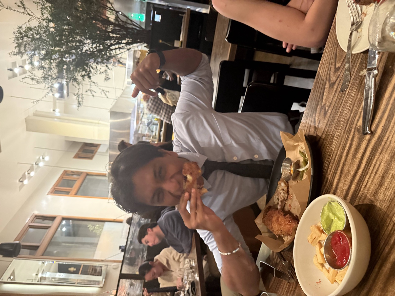 Sid eating dinner at a restaurant