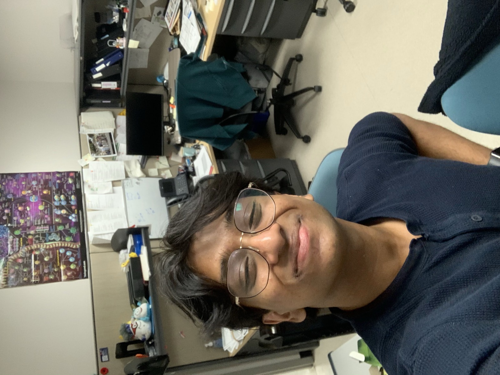 Sid taking a selfie in a lab office