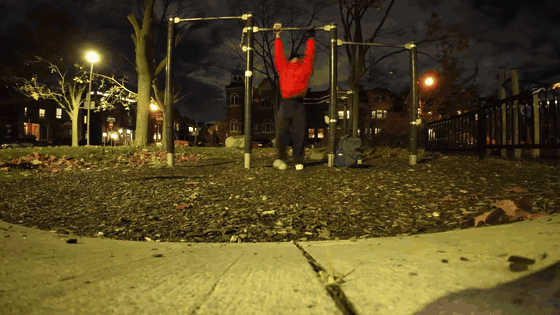 Sid doing pull-ups outside at night